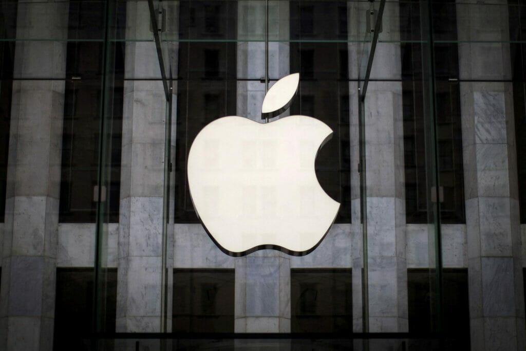 FILE PHOTO: An Apple logo hangs above the entrance to the Apple store on 5th Avenue in the Manhattan borough of New York City, July 21, 2015. REUTERS/Mike Segar/File Photo