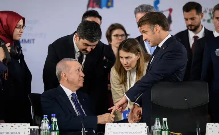 Erdogan Grabs Macron’s Finger at Albanian Summit in Unusual Handshake Moment