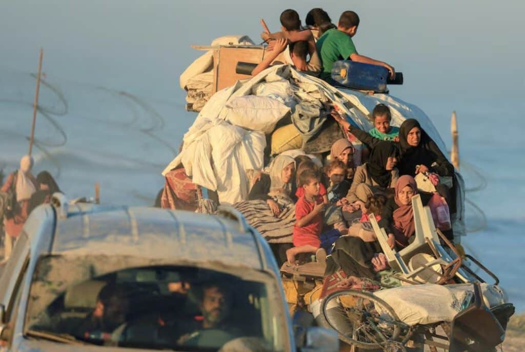 Displaced Palestinians, fleeing northern Gaza due to an Israeli military operation, move southwards after Israeli forces ordered residents of Gaza City to evacuate to the south, in the central Gaza Strip.