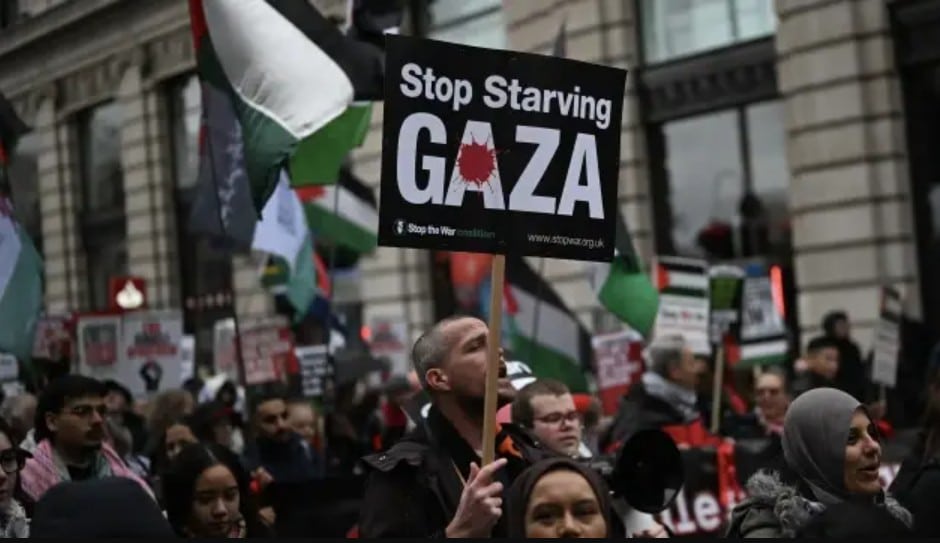 People holding banners and placards, gather for a national march organized by the Palestine Solidarity Campaign on the occasion of the International Day of Solidarity with the Palestinian People on Nov. 29, demanding an end to Israel’s attacks on Palestine and halt to cooperation and arms sales to Israel, in London, United Kingdom on November 29, 2025.
