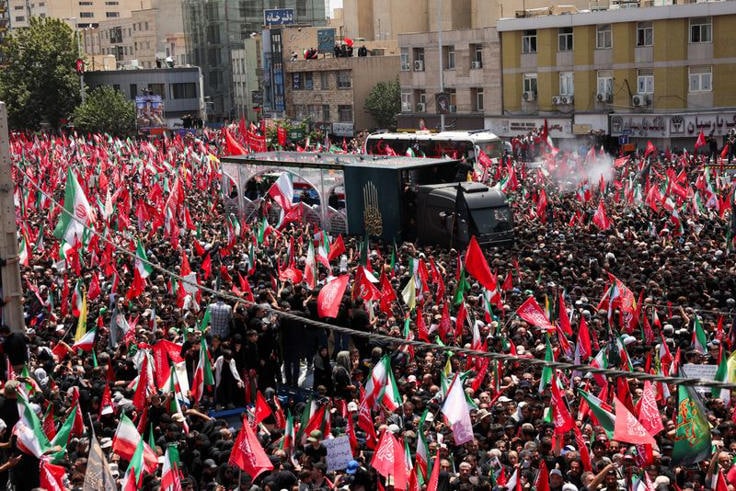 A vehicle carrying coffins of Iran's late Supreme Leader Ayatollah Ali Khamenei and his family members, makes its way as people attend a funeral procession for Khamenei, who was killed on February 28 in Israeli and U.S. airstrikes, in Tehran, Iran, July 6, 2026. Photo: Reuters