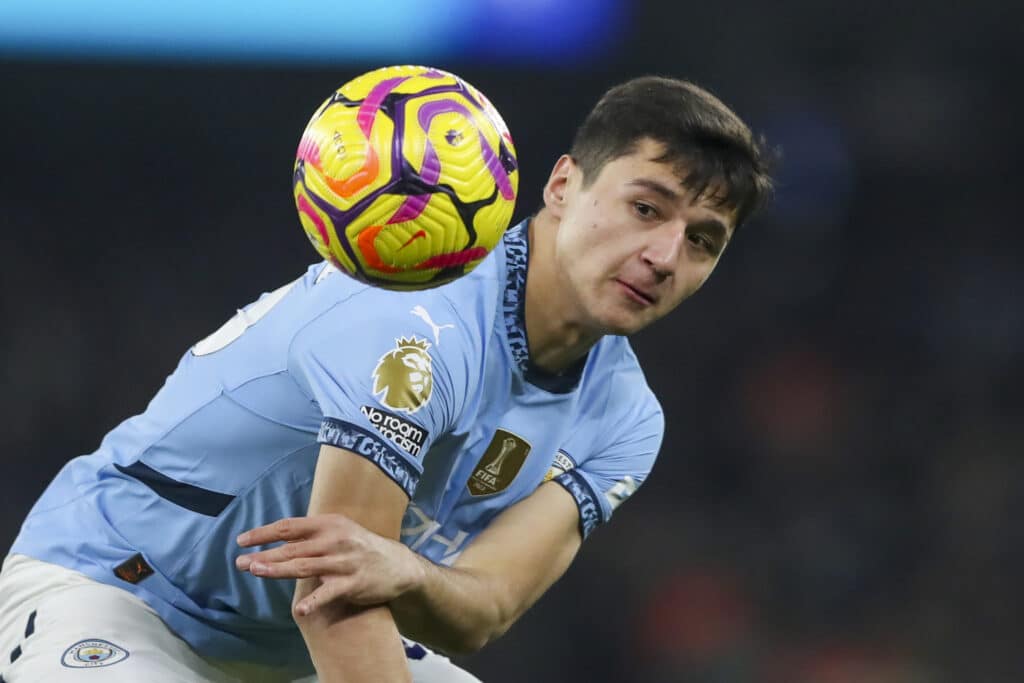 Manchester City's Abdukodir Khusanov heads the ball during the English Premier League soccer match between Manchester City and Chelsea at Etihad Stadium in Manchester, England, Saturday, Jan. 25, 2025. (AP Photo/Scott Heppell)